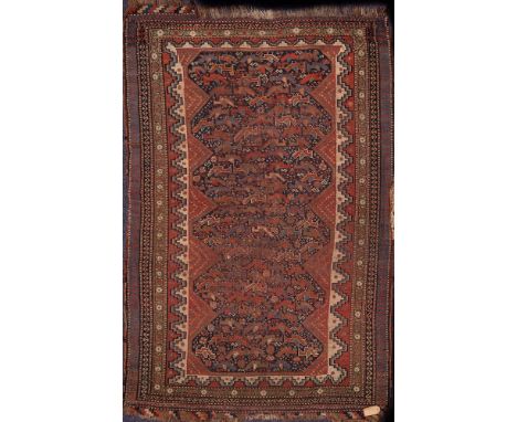 A Quashgai rug:, the indigo field with geometric designs, having stepped surround and main pistachio medallion border, 173cm 