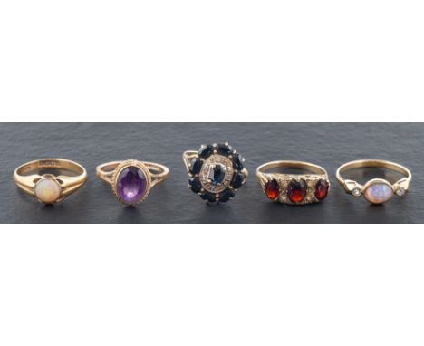 Five rings,: including a 18ct gold opal ring with hallmarks for London, 1916, ring size Q, weight ca. 3.9gms, a 9ct gold amet