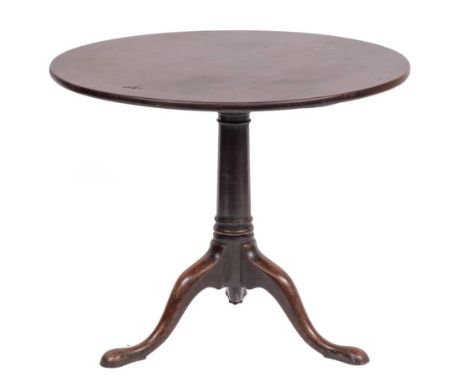 A George II mahogany tripod table, mid 18th century,: the hinged circular top and block on a knop turned columnar shaft, to s