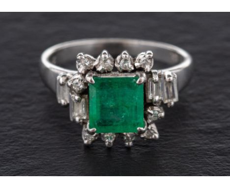 A step-cut emerald, baguette-cut and single-cut diamond cluster ring,: calculated emerald weight ca. 1.50cts, estimated diamo