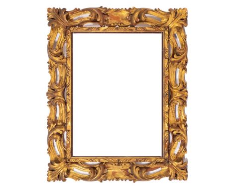 An Italian carved and giltwood rectangular mirror or picture frame, in late Baroque taste, second half 20th century,: the ope