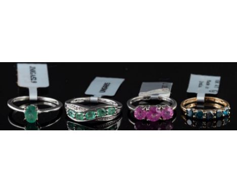 An emerald and diamond ring,: set with five oval cut emeralds, with eight cut diamond accents, stamped 925, ring size R; toge