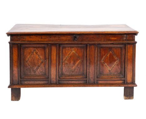 An oak and parquetry coffer, first half 17th century,: the hinged cover with moulded edges, the front with plain frieze above