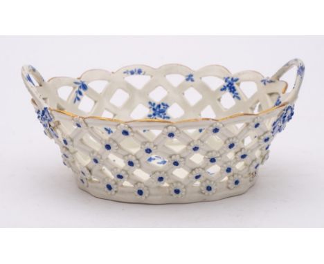 A First Period Worcester blue and white basket: of oval form with twig handles and applied with florets, painted possibly in 