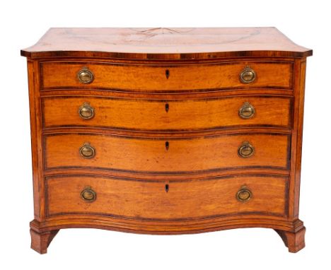 A fine George III satinwood and rosewood crossbanded serpentine commode, in Sheraton style and in the manner of Ince and Mayh