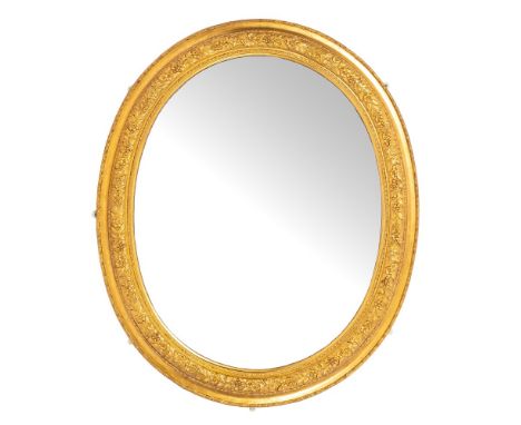 A Victorian giltwood and composition framed oval wall mirror, late 19th century,: the surround with reverse cavetto and folia