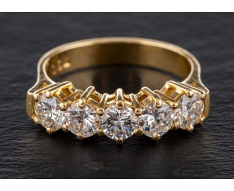 A round, brilliant-cut diamond, half-eternity ring,: total diamond weight 1.24ct according to engraving, G-H colour, VS1-2 cl