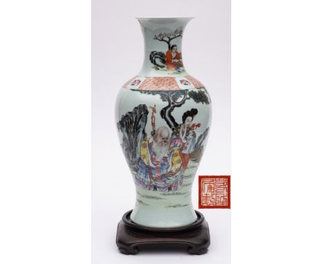 A Chinese famille rose baluster vase: enamelled with a presentation scene depicting the Immortal Shou Lao with officials and 