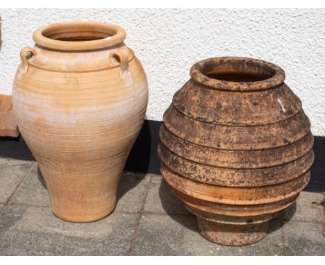 Two terracotta garden pots, second half 20th century,: both of ovoid form with ribbed exterior; the larger example with three