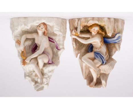 A pair of Royal Worcester tinted parian wall brackets: from a series allegorical of the seasons, modelled as scantily clad ma