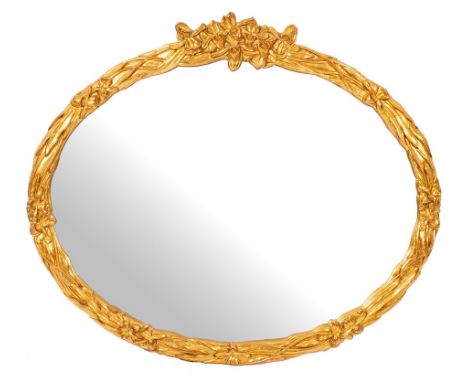 A gilt composition framed oval wall mirror, of recent manufacture,: with stylised floral and foliate moulded surround; 108cm 