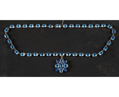 A 15ct gold, early 19th century, faceted light blue paste, necklace with a detachable, cruciform light and deep blue faceted 