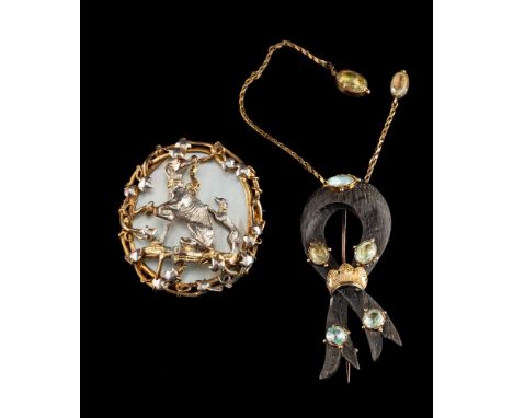 An oval, mother-of-pearl brooch,: the two greyhounds within a foliate surround, length ca. 4.8cm, total weight ca. 24.gms. 