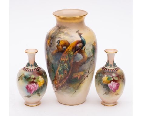 Three Royal Worcester porcelain vases: one of slender oviform painted by Reginald Austin with a large pair of pheasants perch