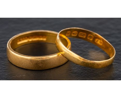 Two 22ct gold band rings,: both with hallmarks for Birmingham, one, 1984, ring size L; the other, 1849, ring size K, total we