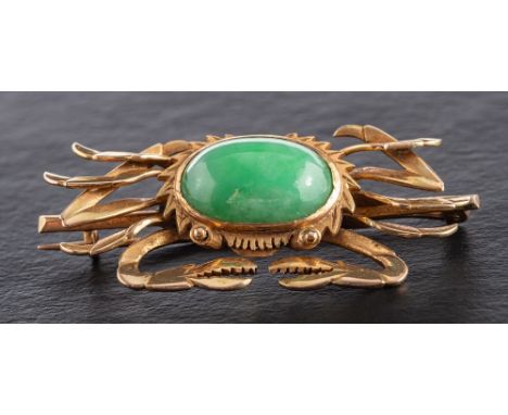 A mid-20th century, crab jade brooch,: stamped '14K', length ca. 4.5cm, total weight ca. 8.3gms. 