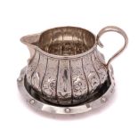 A Victorian silver cream jug, maker's mark worn, London,
