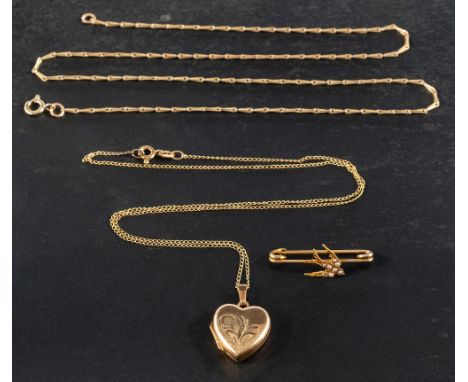 A locket, a brooch and two chains,: including a 9ct gold heart-shaped locket with foliate engraving and hallmarks for Birming