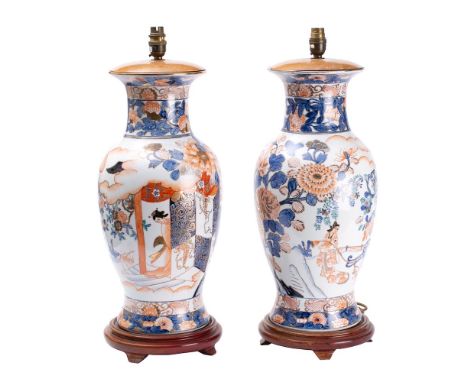 A pair of modern Chinese Imari style vases: of ovoid form, with figures in a garden together with floral sprays and clobbered