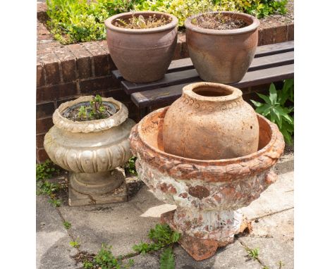 A group of five various terracotta and stoneware garden pots and urns, late 19th and 20th century,: the largest modelled with