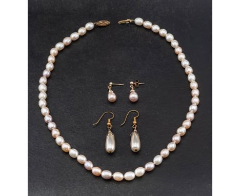 A cultured pearl necklace and pair of earrings,: the pearls of varying hues of pink and of ovoid form, diameter ca. 6.5-9mms,