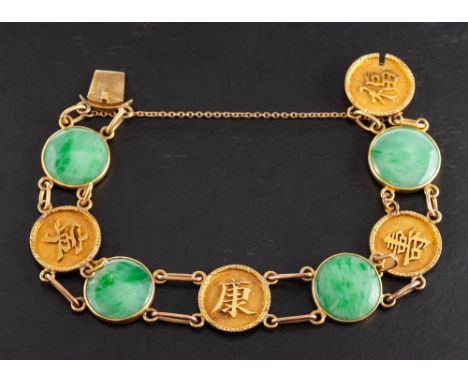 A mid-20th century, jade bracelet,: stamped '20', length ca. 17.5cm, total weight ca. 18.7gms. 