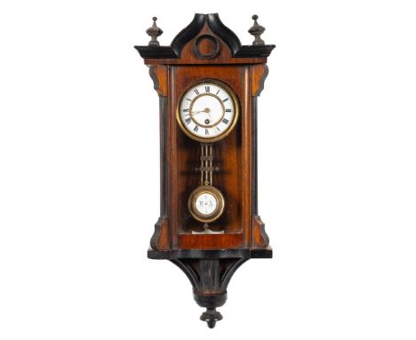A miniature Vienna-style wall clock: having an eight-day duration spring-driven movement with a three-rod pendulum, the two-p