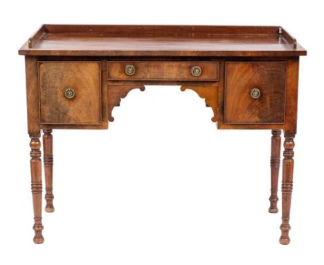 A Regency mahogany washstand or dressing table, early 19th century,: the rectangular top with (later) three-quarter gallery, 