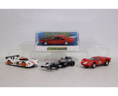 Scalextric - 4 x slot cars, a Dodge Challenger in an unmarked box, a Ferrari P4, a McLaren Mercedes MP4-24 and a Le Mans car.