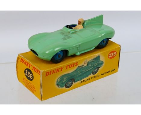 Dinky - A boxed Jaguar D Type # 238. The model appears in Near Mint condition with only a couple of minor marks, it would ben