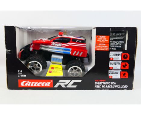 Carrera - A boxed Carrera RC 1:14 scale 'Fire Fighter Watergun' vehicle. The model comes with controller and appears to be in