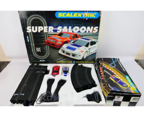 Scalextric - Hornby - A Super Saloons Scalextric set (#C1016) and Track extension pack B (#C8035). Items appear to be in very
