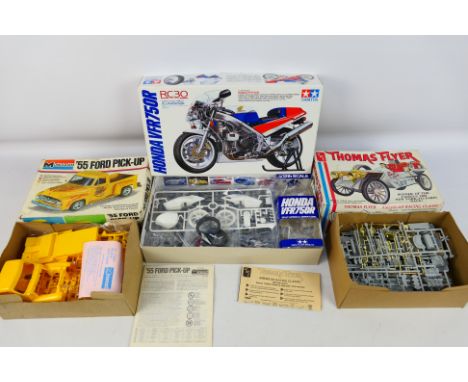 Tamiya - AMT - Monogram - Three boxed plastic model kits in various scales. Lot consists of Tamiya #14057 1:12 scale Honda VF