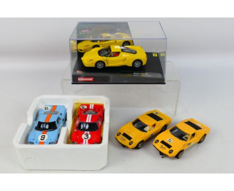 Scalextric - Carrear Four unboxed Scalextric slot cars with a boxed Carrera #25703 Ferrari Enzo (appears Mint in Excellent bo