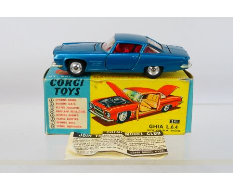 Corgi - A boxed Ghia L6.4 in blue with red interior # 241. The car appears in Very Good condition with some light marks, the 