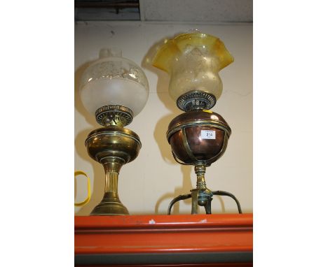 A VINTAGE MESSENGERS PATENT COPPER OIL LAMP ON BRASS STAND TOGETHER WITH A BRASS EXAMPLE