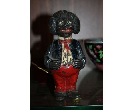 A VINTAGE CAST METAL MONEY BANK