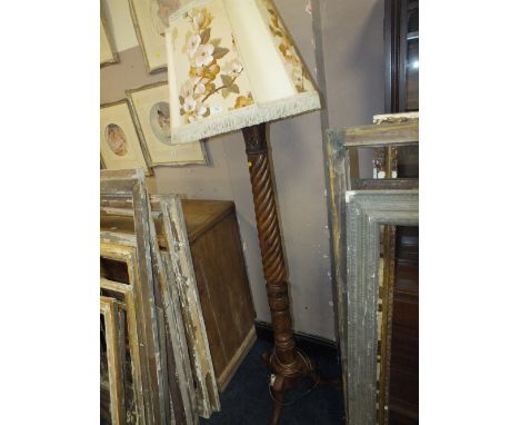 A CARVED STANDARD LAMP AND RETRO SHADE