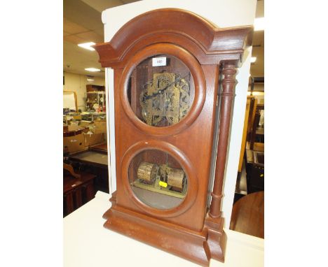 AN UNUSUAL MAHOGANY CASED CLOCK WITH VISIBLE MOVEMENT AND DAY / MONTH ROLLS, H 69 CM