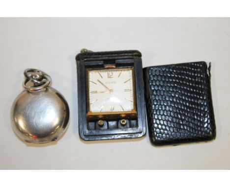 A HALLMARKED SILVER SOVEREIGN HOLDER TOGETHER WITH A POCKET TRAVEL CLOCK