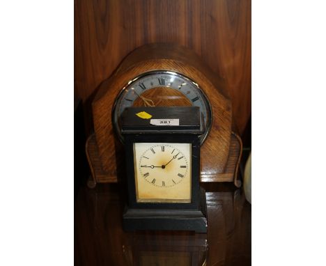A RIVETTE MANTLE CLOCK TOGETHER WITH AN OAK EXAMPLE