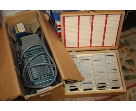 A VINTAGE SLIDE PROJECTOR AND SLIDES