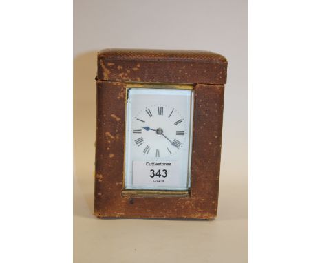 A CASED VINTAGE FRENCH BRASS AND GLASS CARRIAGE CLOCK 