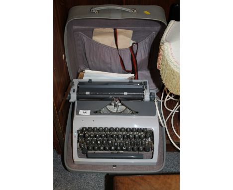 A CASED VINTAGE TYPEWRITER