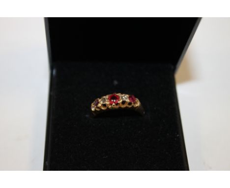 A HALLMARKED 18 CARAT GOLD RUBY AND DIAMOND RING