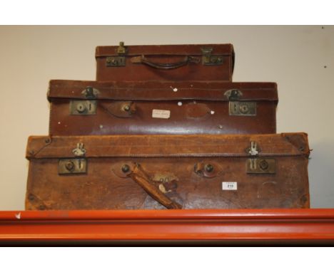 THREE VINTAGE SUIT CASES /F