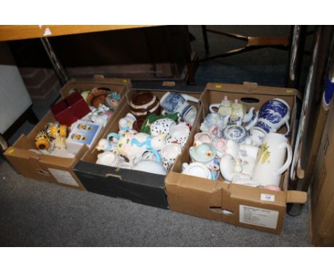 THREE TRAYS OF NOVELTY CERAMIC TEAPOTS ETC. 