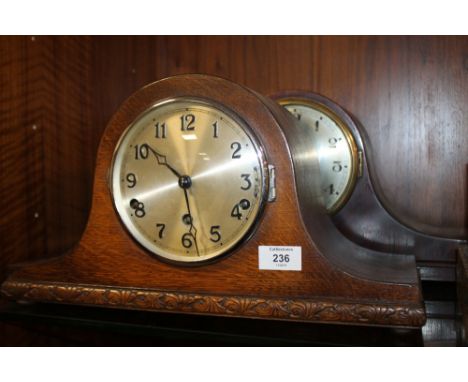 A OAK NAPOLEON HAT MANTLE CLOCK CHIMING ON BARS TOGETHER WITH A MAHOGANY EXAMPLES