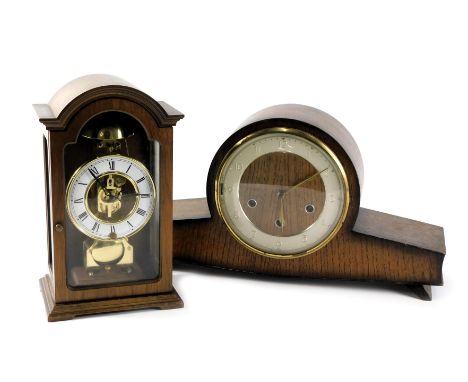 A 1950s/60s oak cased mantel clock with Westminster chime, and a Continental mantel clock in a mahogany case. (2) 