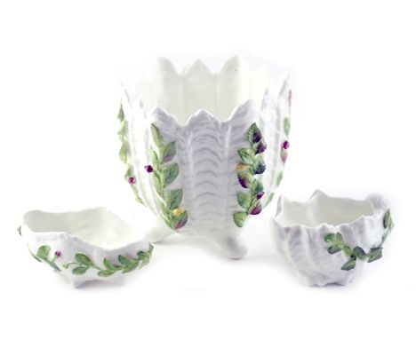 Three Coalport Arcadian pattern china wares, comprising a shell capped pin dish, pin dish, and a planter, each on a white she